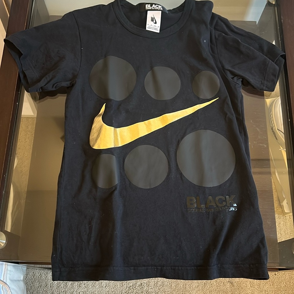 Come des garçons + Nike collab black t shirt with gold swoosh
